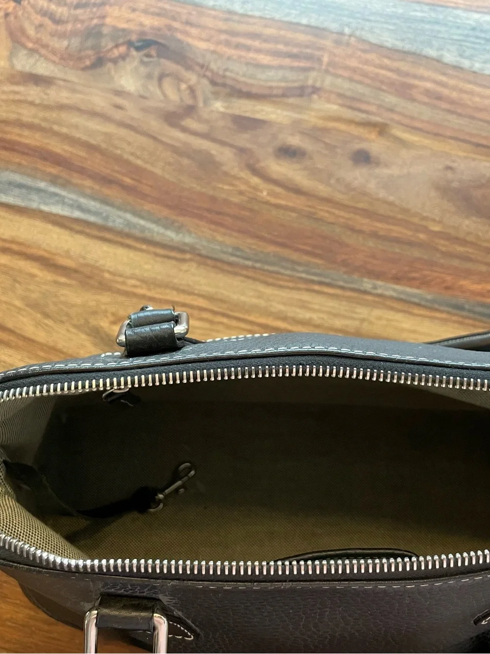 Dooney & Bourke Black Pebbled Leather Satchel with Logo Emblem